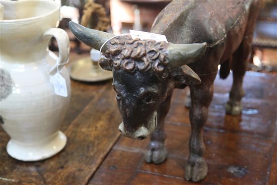 An 18th / 19th century carved and painted figure of a bullock, possibly from a Créche group, L.14.75in.